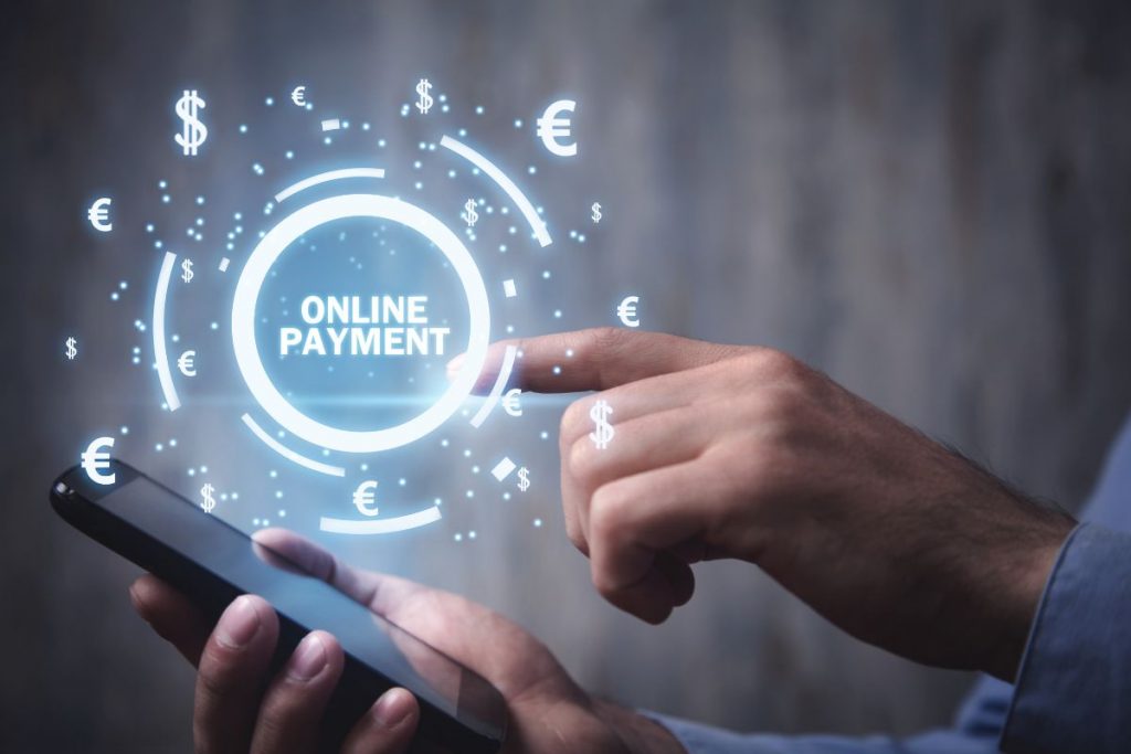 A man is using his phone to make an online payment.