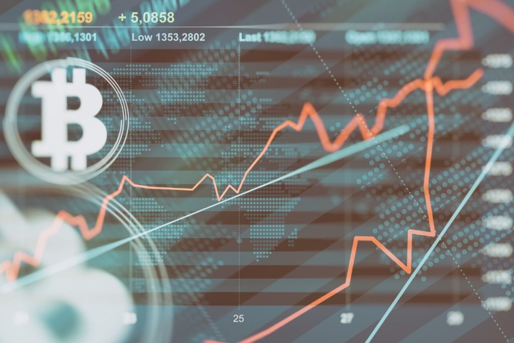 Bitcoin symbol overlaid on a stock market graph, representing cryptocurrency investments and market fluctuations, relevant to IRS Crypto Tax Rules.